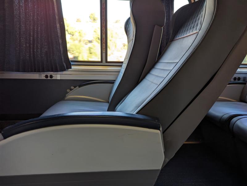 A Superliner coach seat, fully reclined, which is about 45° down