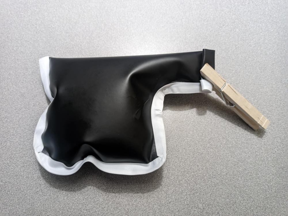 A tiny plastic Uilleann pipe bag