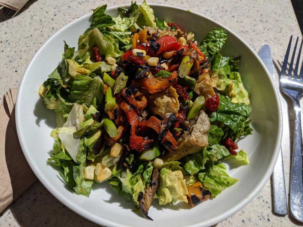 Salad with some sun dried tomatoes on it